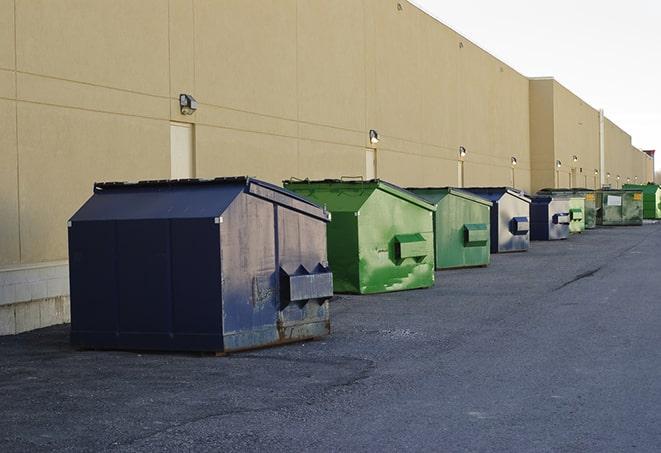 construction dumpsters stacked in a row on a job site in Blackstone